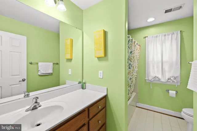 a bedroom with bed and window