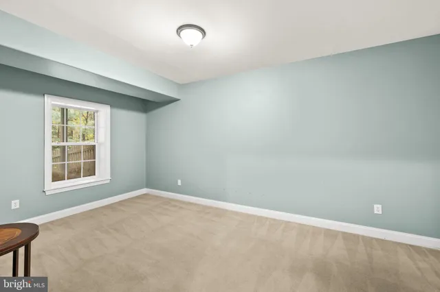 a view of balcony with wooden fence and trees