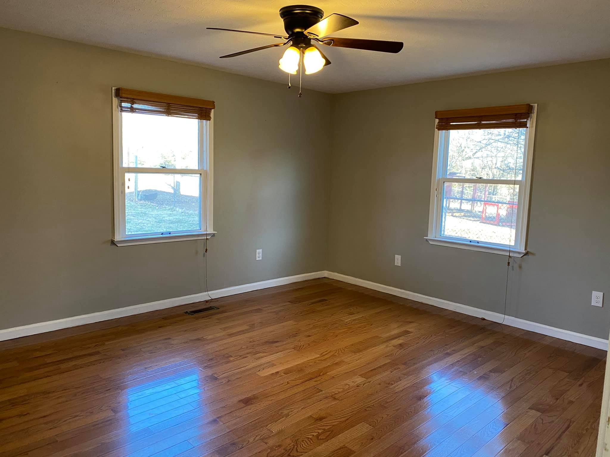 3440 Vesta Road Lebanon, TN 37090 - Photo 12 of 37 a view of an empty room with wooden floor and a window