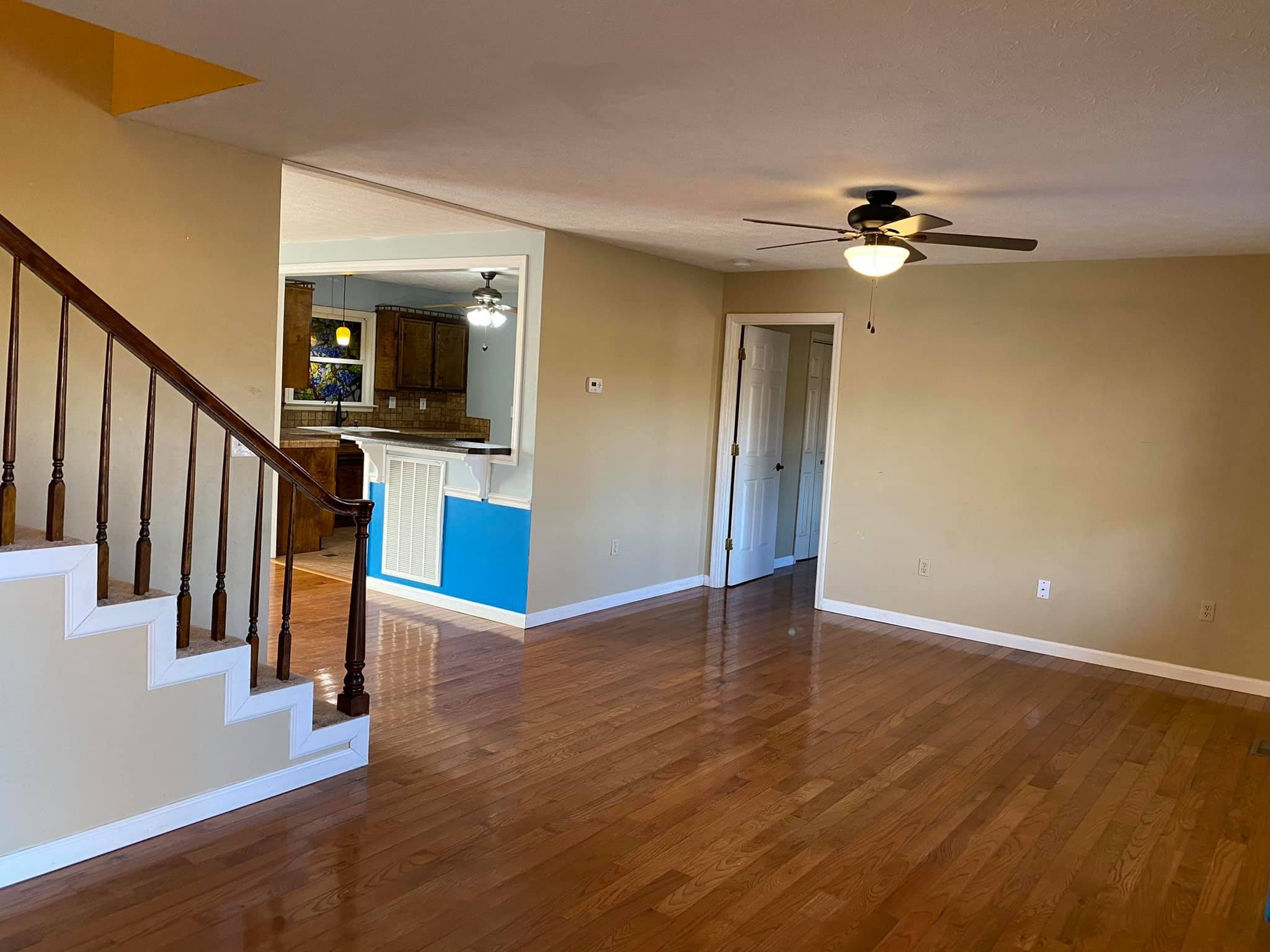 3440 Vesta Road Lebanon, TN 37090 - Photo 4 of 37 a view of a hallway with wooden floor and staircase
