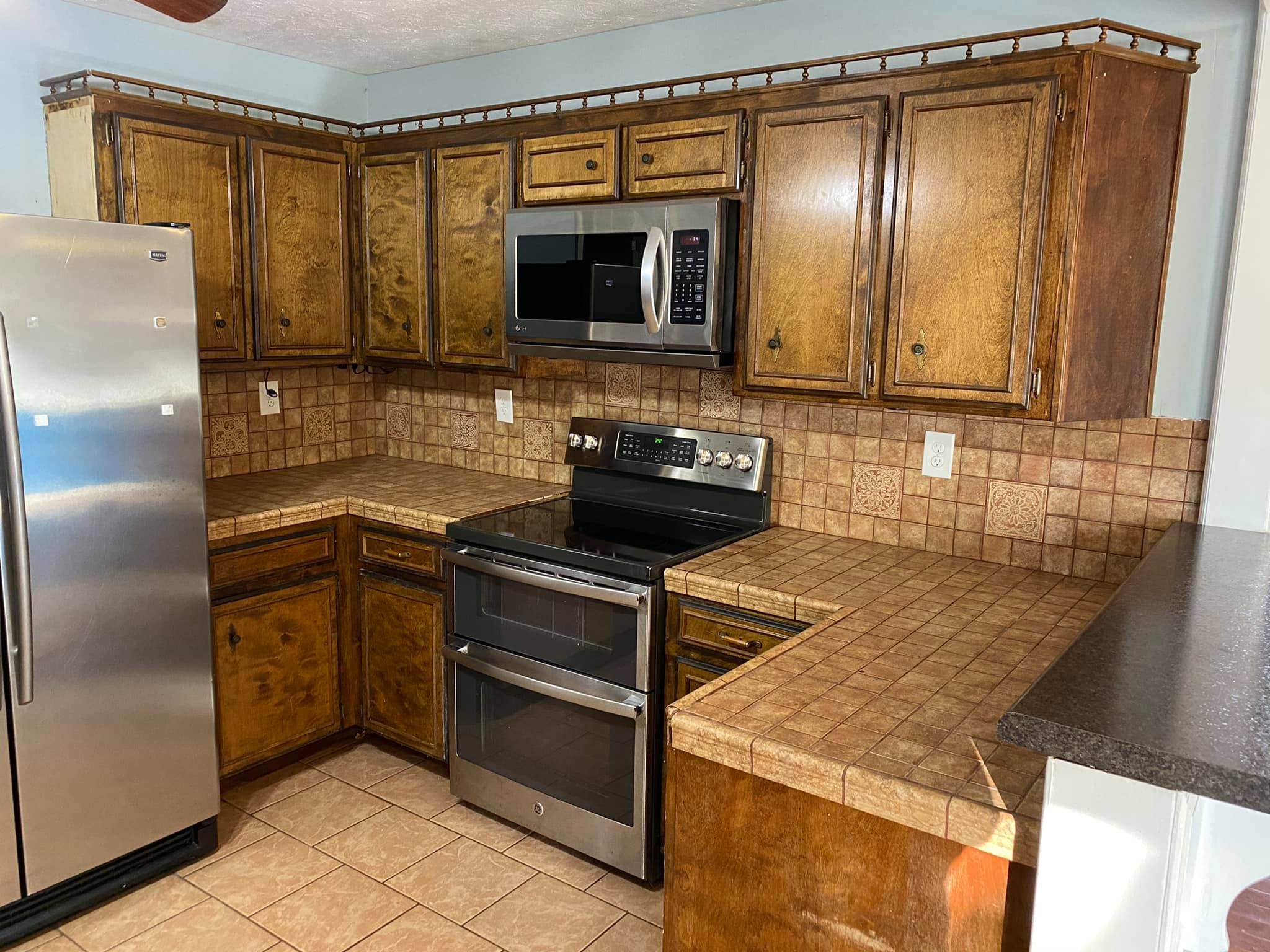 3440 Vesta Road Lebanon, TN 37090 - Photo 7 of 37 a kitchen with a sink and a refrigerator