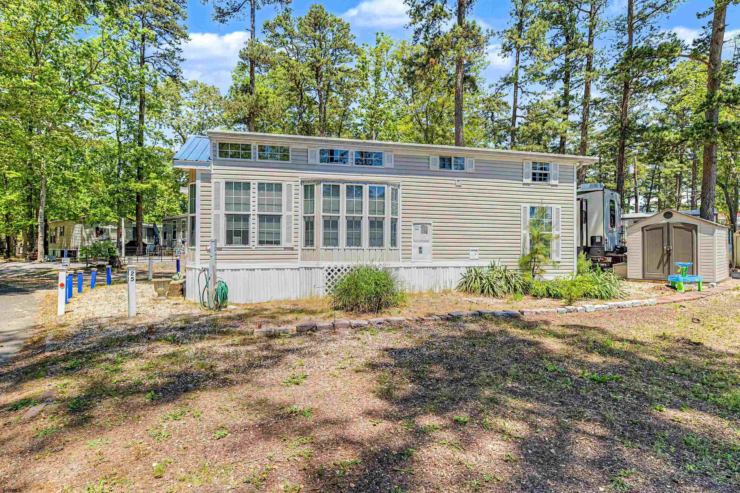 3066 Route 9 Ocean View, NJ 08230 - Photo 22 of 29 front view of a house with a yard