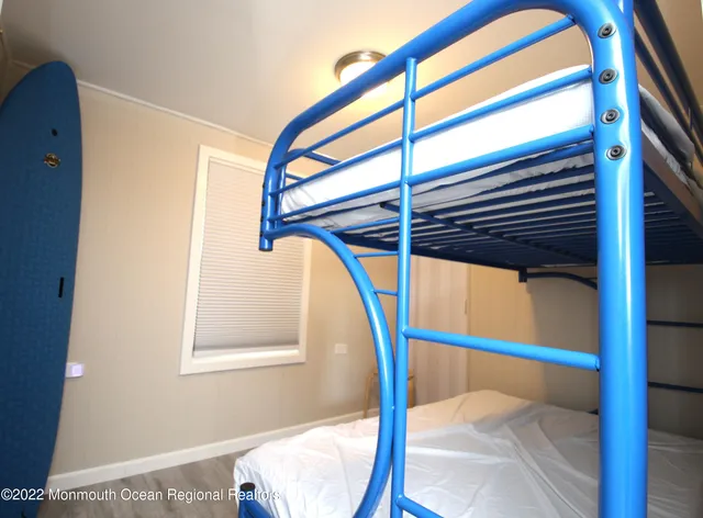a view of balcony with two chairs and potted plants