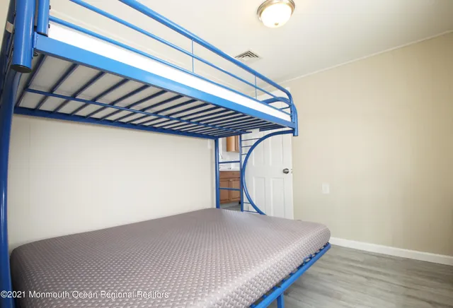 a bathroom with a sink mirror and shower