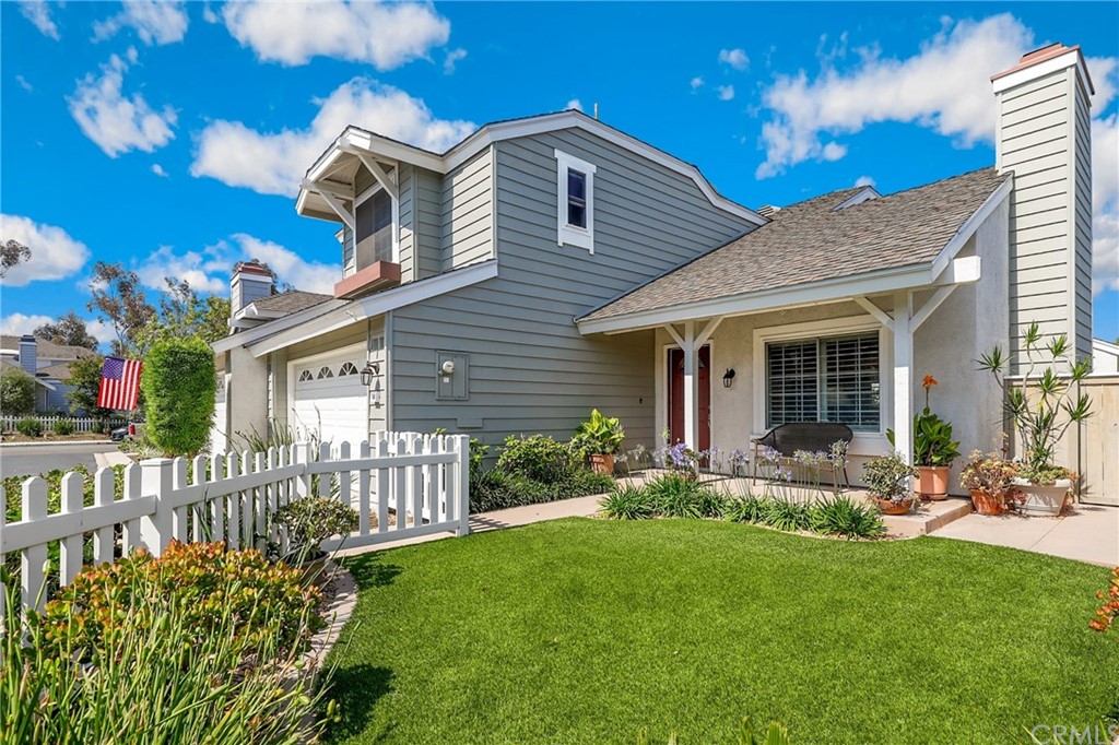 14 Wintermist, Unit 83 Irvine, CA 92614 - Photo 4 of 45 a front view of house with yard and green space