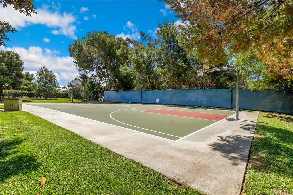 14 Wintermist, Unit 83 Irvine, CA 92614 - Photo 42 of 45 a view of a swimming pool with a yard