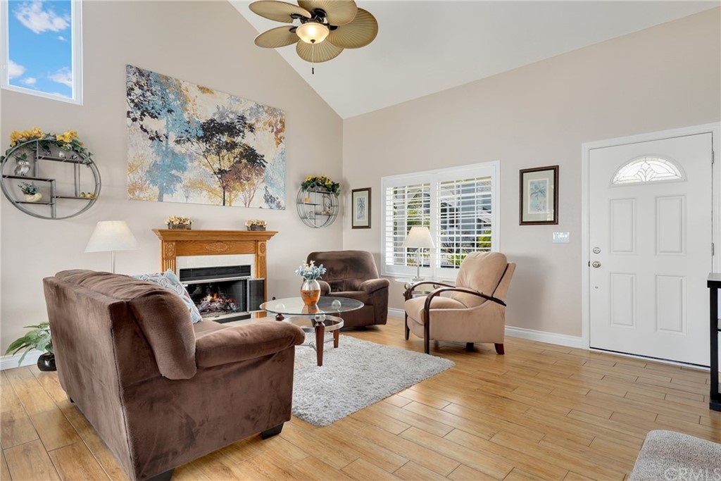 14 Wintermist, Unit 83 Irvine, CA 92614 - Photo 10 of 45 a living room with furniture and a fireplace