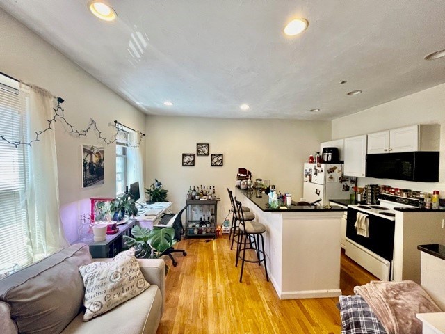 17 Thacher Street, Unit 3 Boston, MA 02113 - Photo 2 of 24 a view of a living room and a kitchen