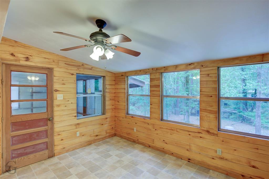 1267 Johnson Road Doyline, LA 71023 - Photo 11 of 19 a view of a livingroom with a chandelier fan and windows