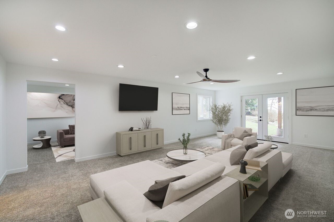 10405 Samish Island Road Bow, WA 98232 - Photo 15 of 38 a living room with furniture and a flat screen tv