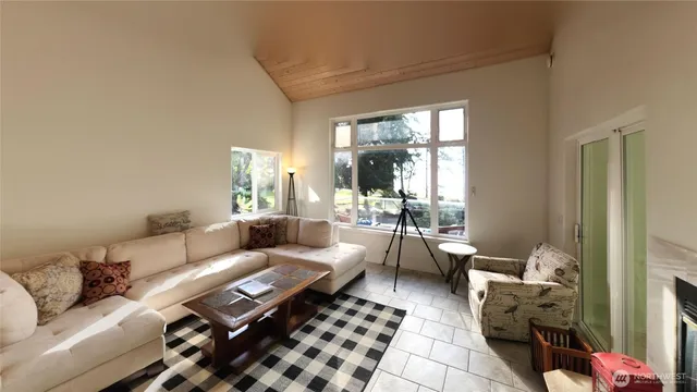 a living room with furniture and a rug