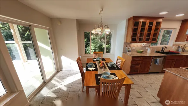 a dining room with furniture and window