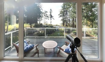 10405 Samish Island Road Bow, WA 98232 - Photo 33 of 38 a view of a balcony with chairs and a table