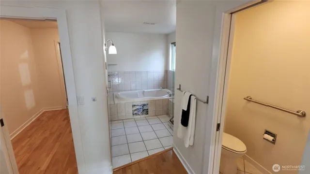 a large bathroom with a double vanity sink and a mirror
