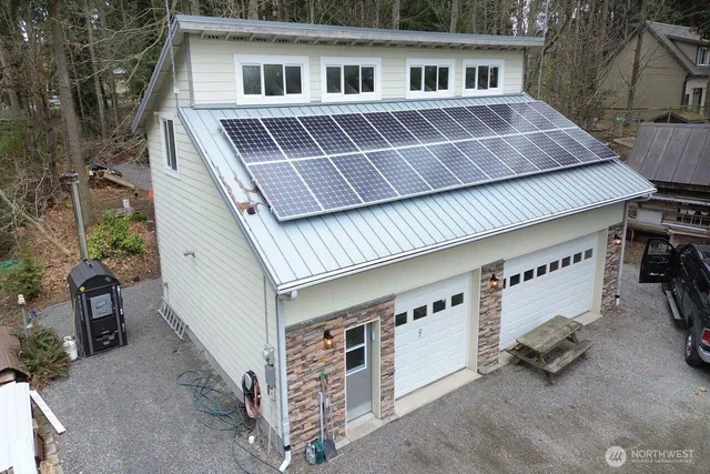 a view of a house with a yard and roof deck