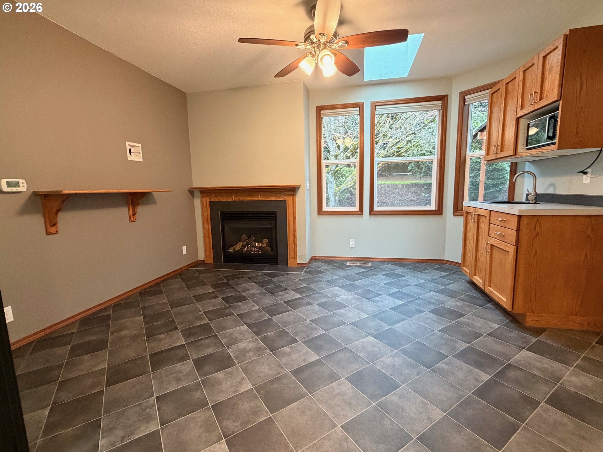 7505 Southwest Schroeder Way Wilsonville, OR 97070 - Photo 11 of 24 a view of an empty room with a fireplace and a window