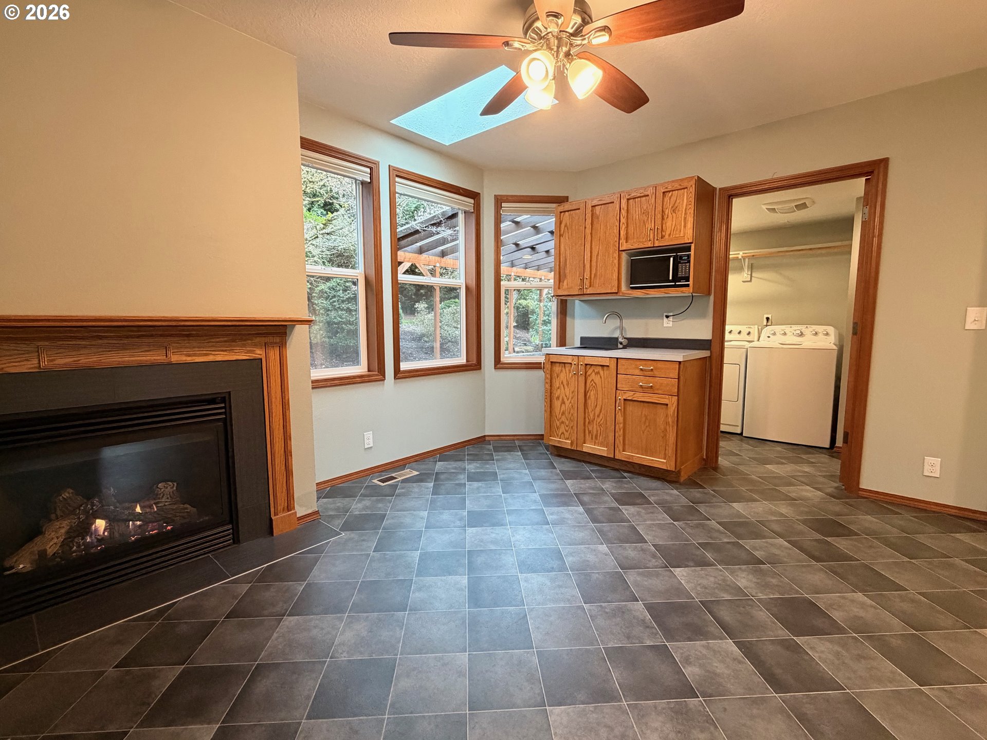 7505 Southwest Schroeder Way Wilsonville, OR 97070 - Photo 12 of 24 a view of a kitchen with a stove cabinets and a fireplace
