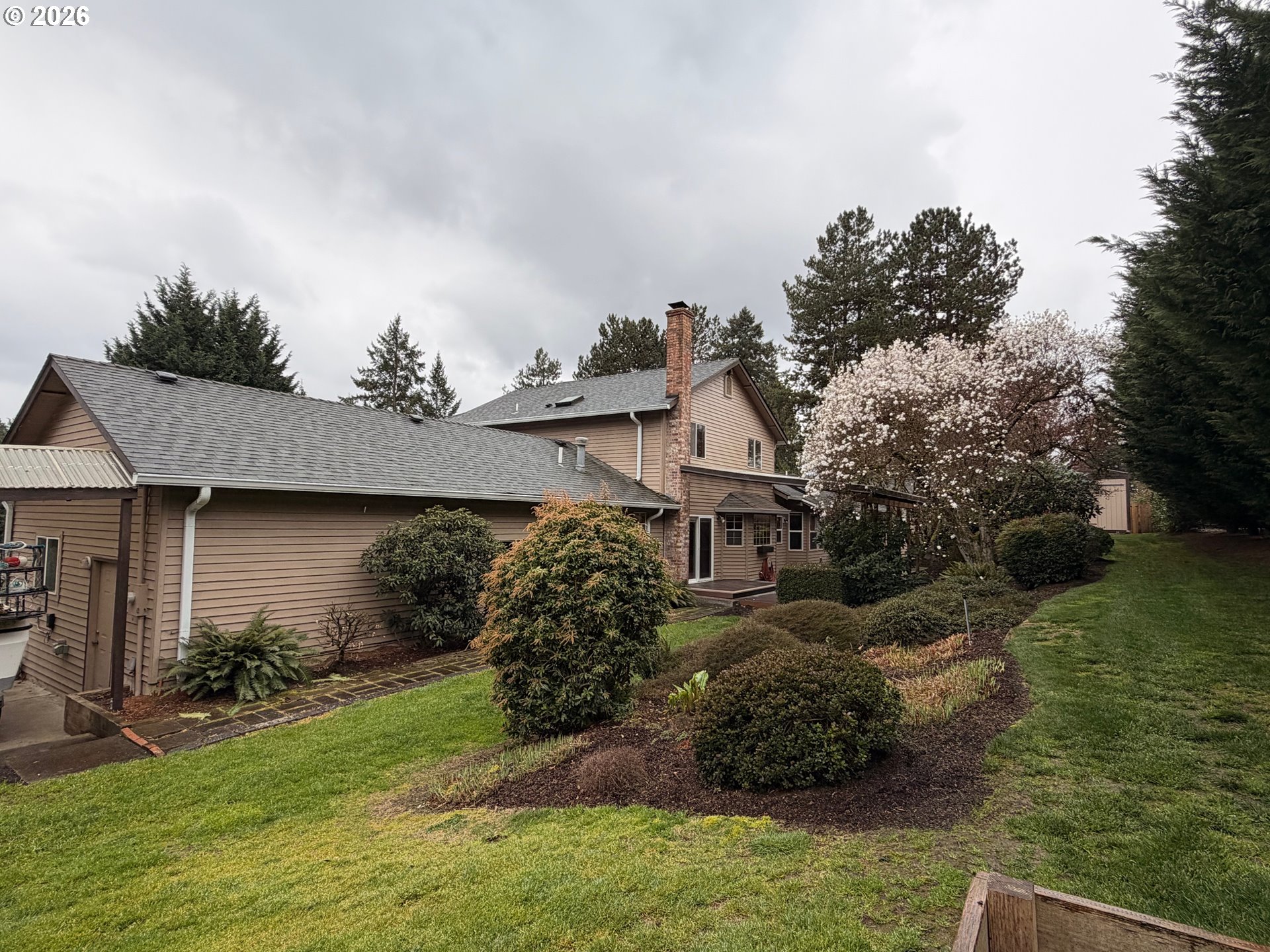 7505 Southwest Schroeder Way Wilsonville, OR 97070 - Photo 15 of 24 a view of a house with a garden