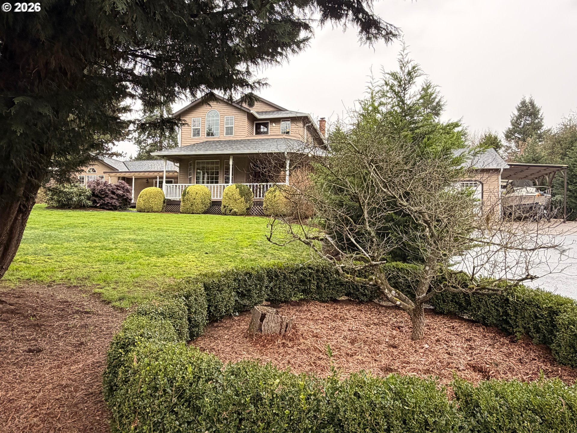 7505 Southwest Schroeder Way Wilsonville, OR 97070 - Photo 17 of 24 a front view of a house with a garden