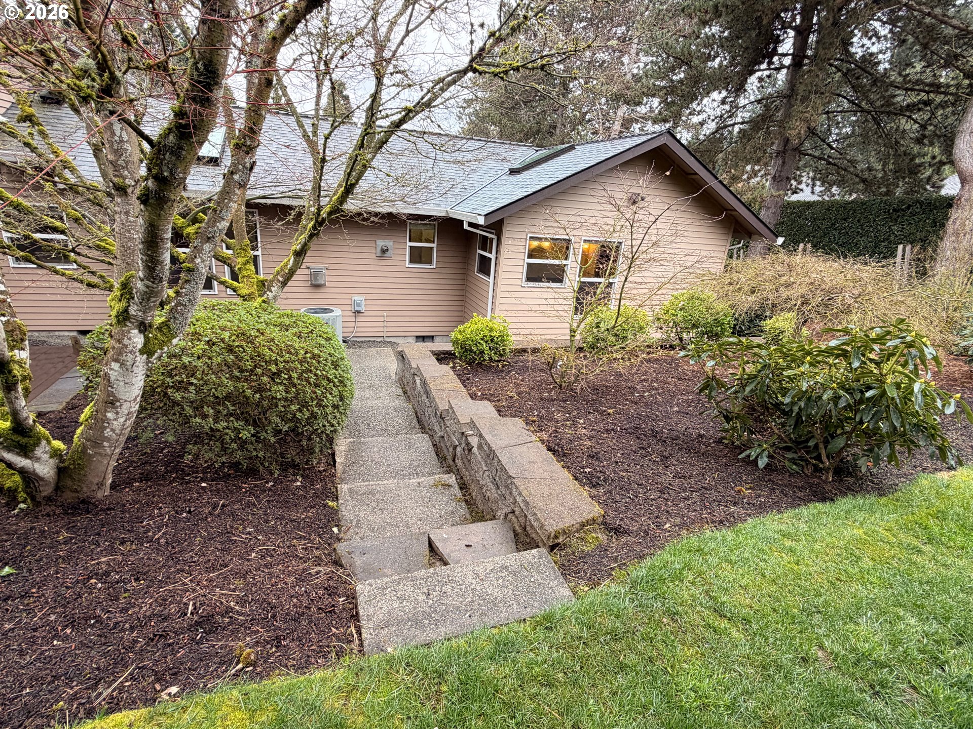 7505 Southwest Schroeder Way Wilsonville, OR 97070 - Photo 24 of 24 a front view of a house with garden