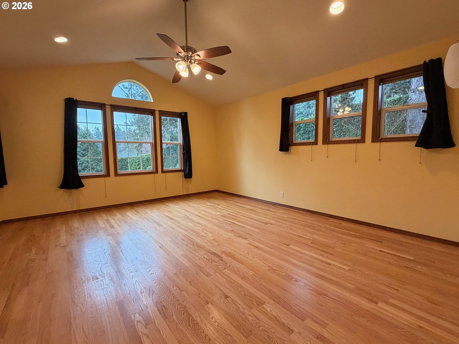 7505 Southwest Schroeder Way Wilsonville, OR 97070 - Photo 7 of 24 a view of an empty room with wooden floor and a window