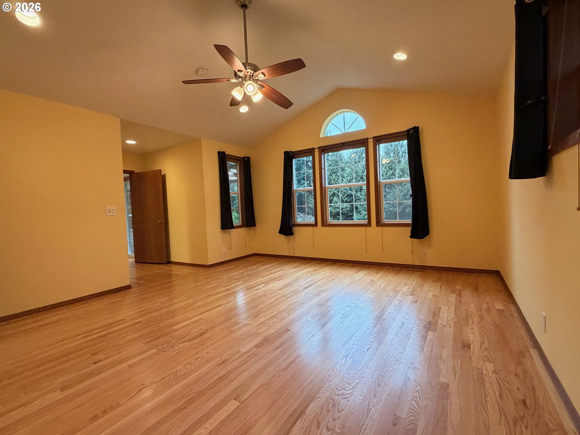7505 Southwest Schroeder Way Wilsonville, OR 97070 - Photo 10 of 24 a view of an empty room with wooden floor and a window