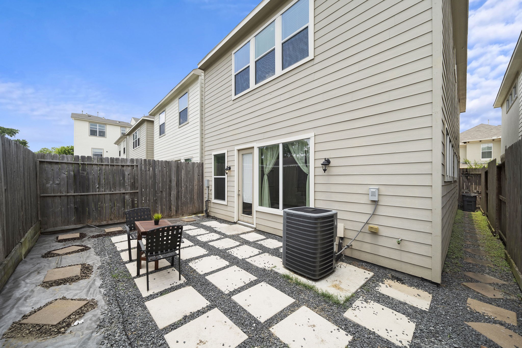 9517 Cedarpost Square Street Houston, TX 77055 - Photo 18 of 20 a view of a chairs and table in backyard