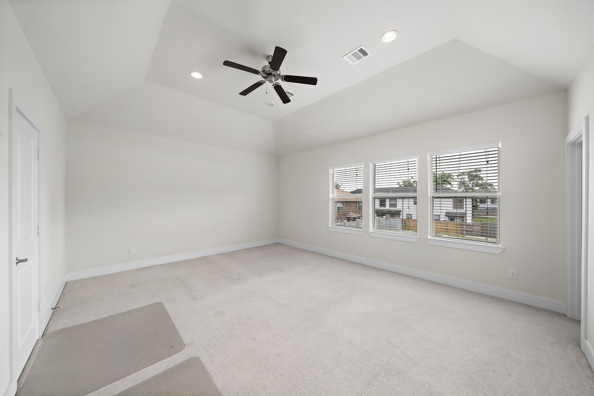 9517 Cedarpost Square Street Houston, TX 77055 - Photo 9 of 20 wooden floor in an empty room with a window