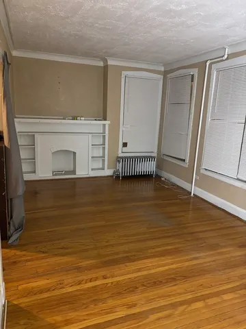 a view of livingroom with floor to ceiling window and wooden floor