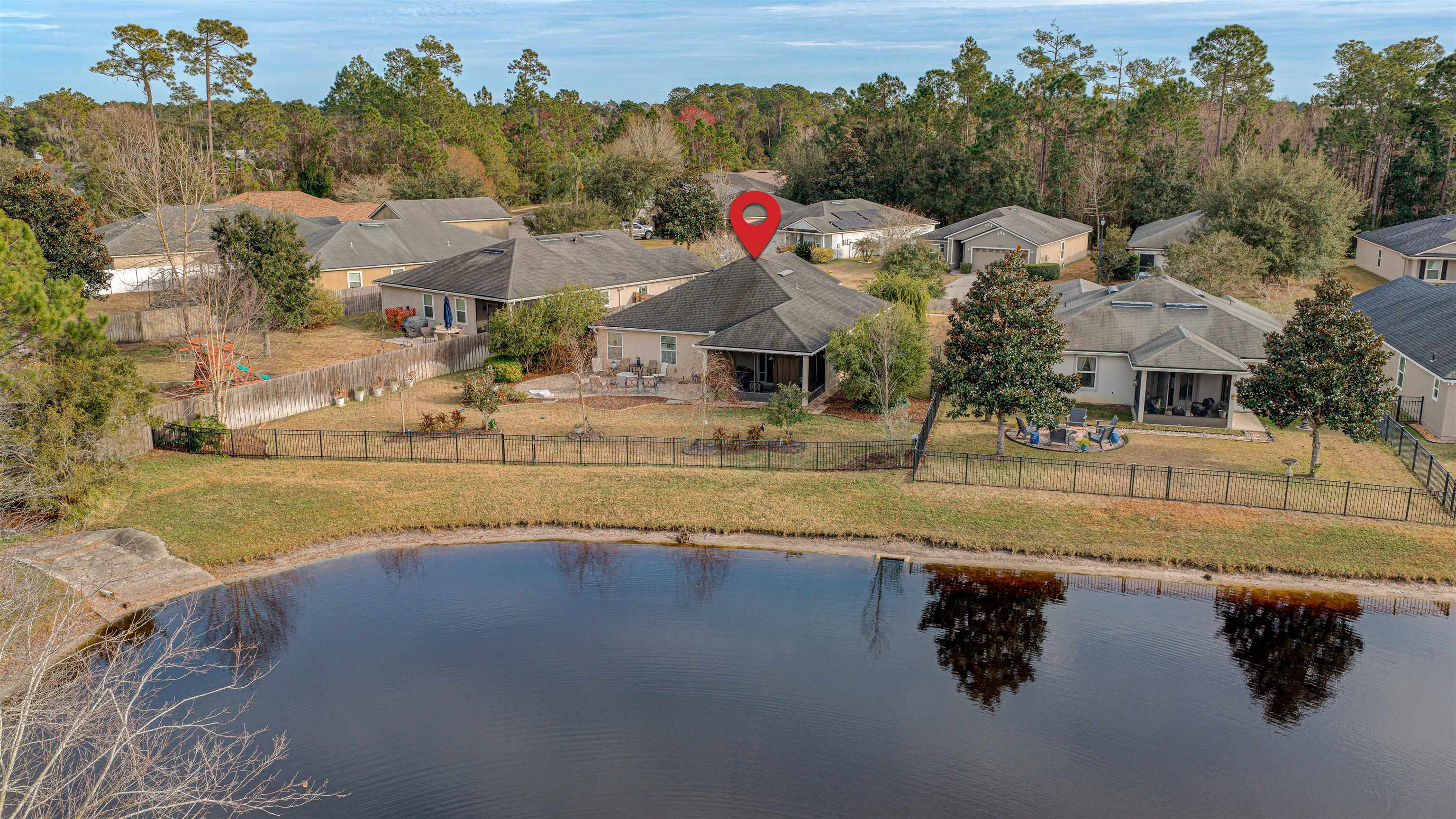 292 North Twin Maple Road St. Augustine, FL 32084 - Photo 11 of 79 a view of swimming pool with outdoor seating and trees in the background