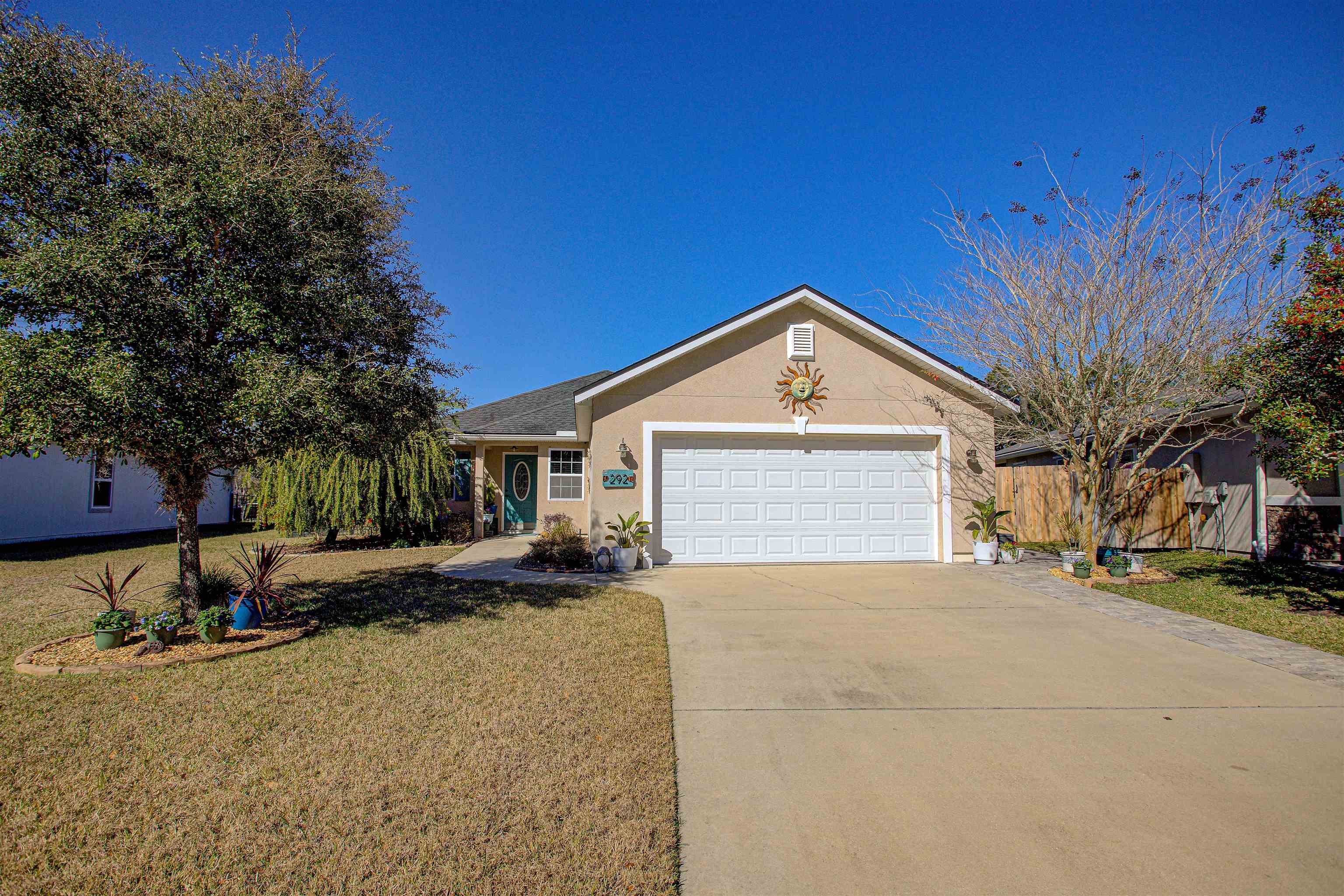 292 North Twin Maple Road St. Augustine, FL 32084 - Photo 17 of 79 a view of a house with a yard and garage