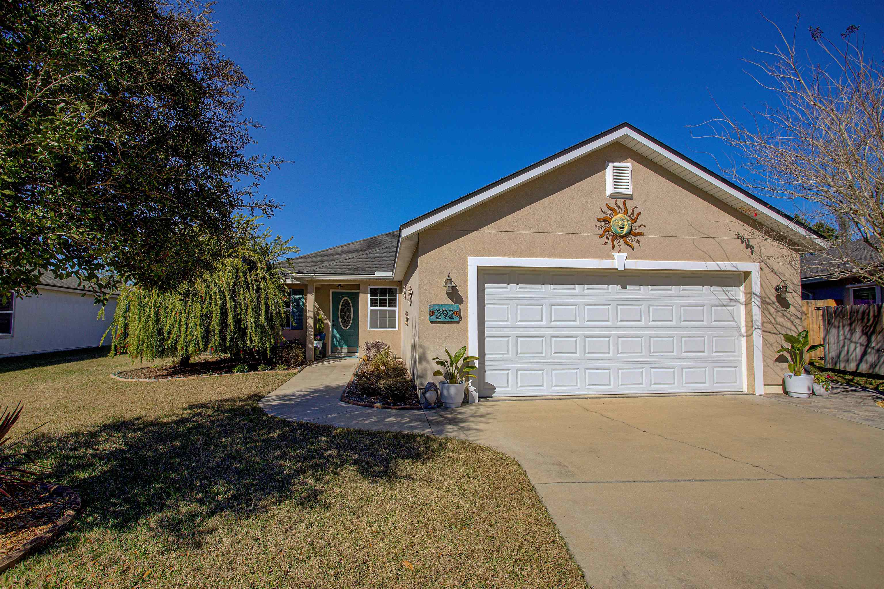 292 North Twin Maple Road St. Augustine, FL 32084 - Photo 19 of 79 a view of a house with a yard and potted plants