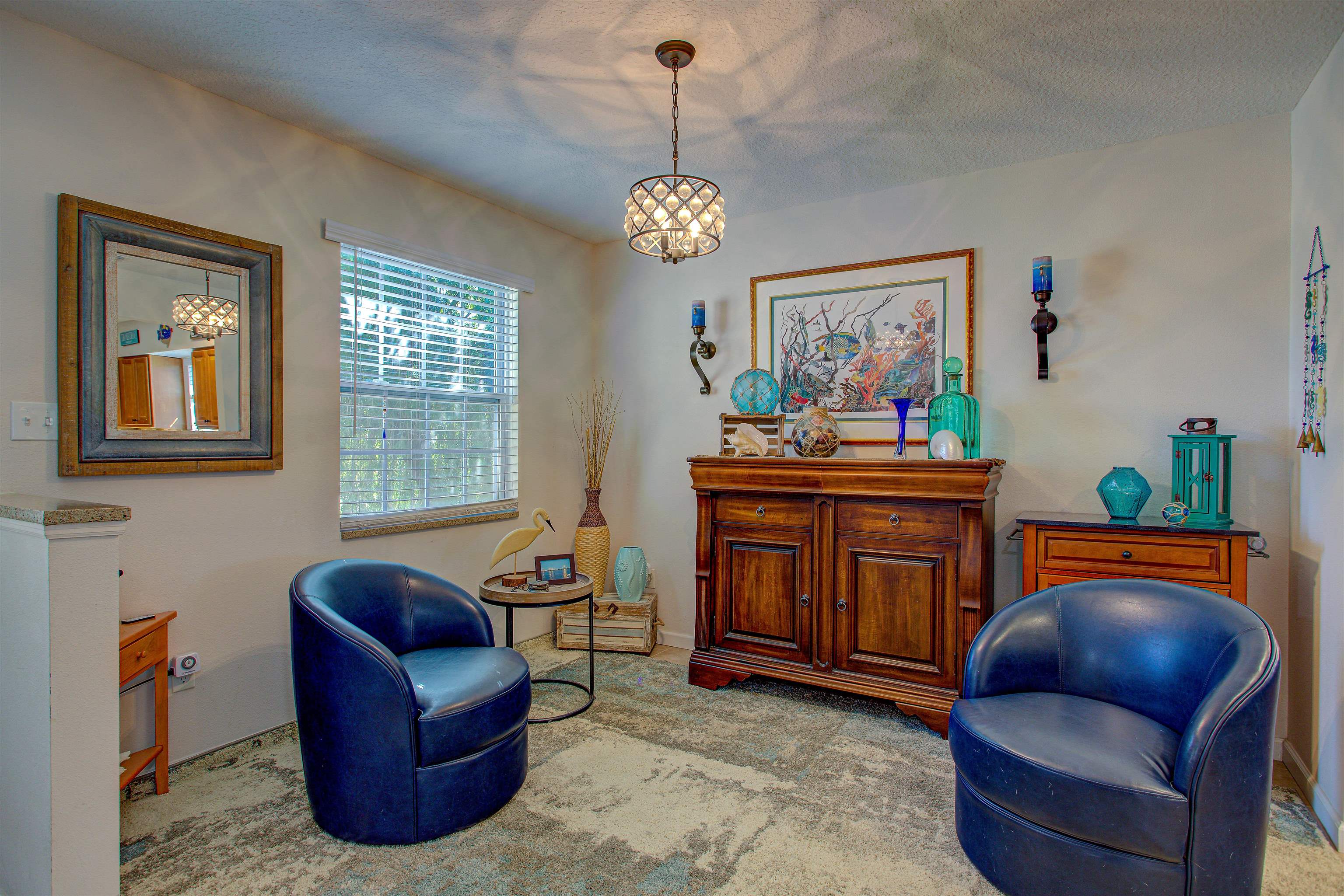 292 North Twin Maple Road St. Augustine, FL 32084 - Photo 23 of 79 Living area featuring a chandelier and a textured ceiling