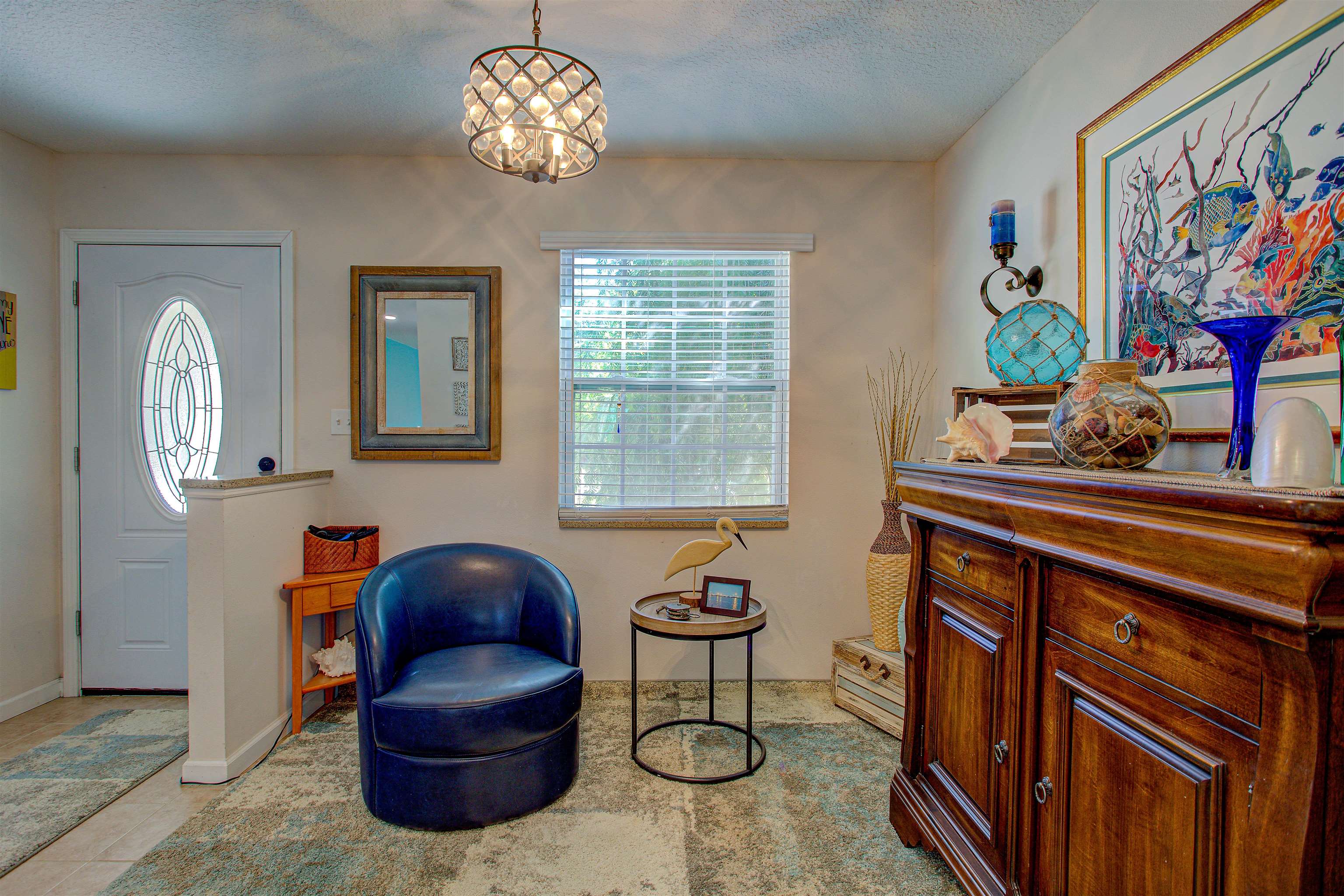 292 North Twin Maple Road St. Augustine, FL 32084 - Photo 25 of 79 Entrance foyer with a chandelier, light tile patterned flooring, and a textured ceiling