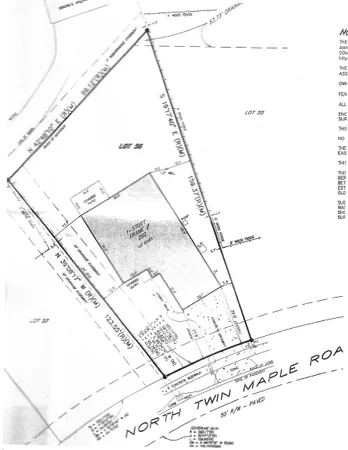 a view of a house with a yard and garage