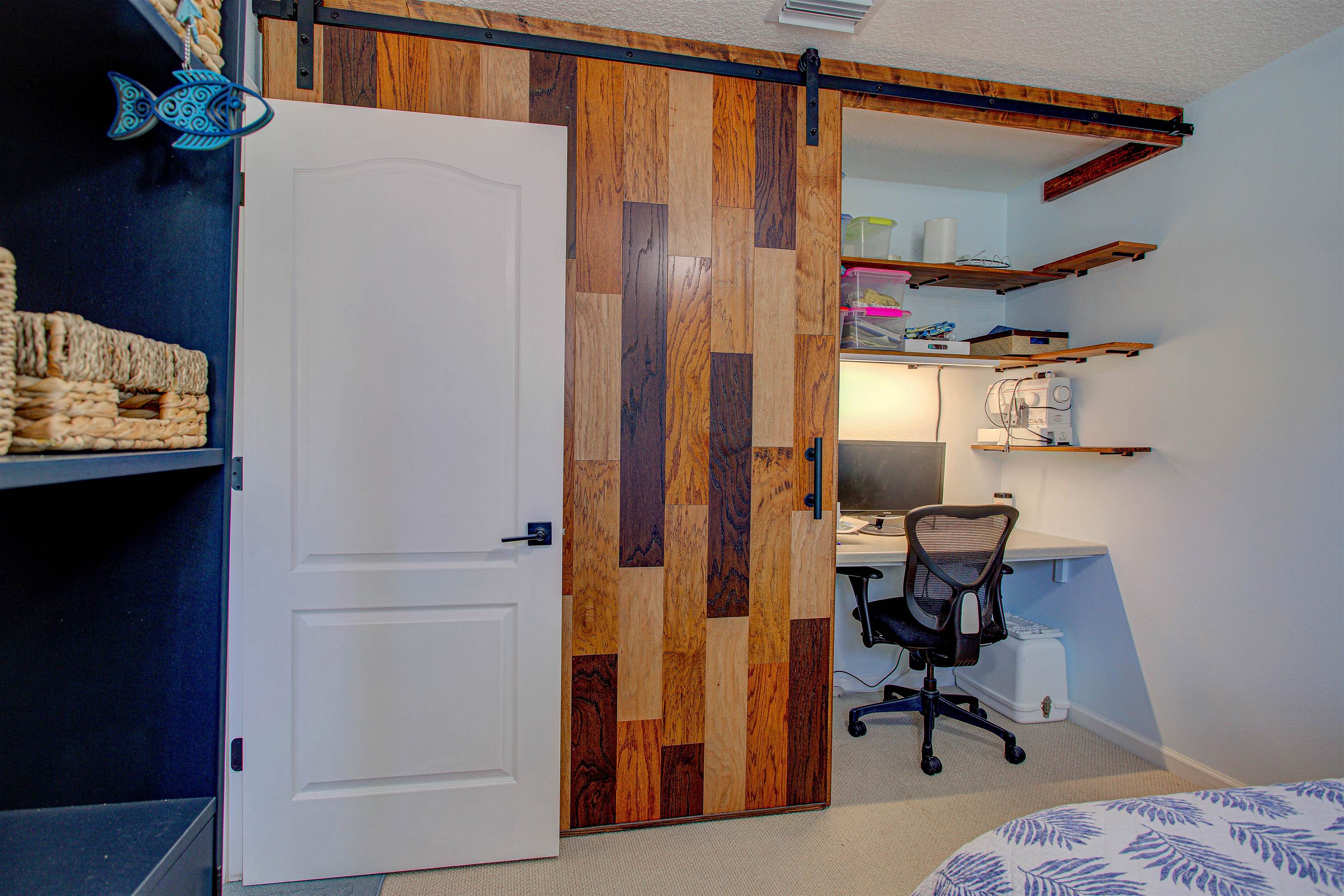 292 North Twin Maple Road St. Augustine, FL 32084 - Photo 30 of 79 Carpeted bedroom featuring a desk, a barn door, and a textured ceiling