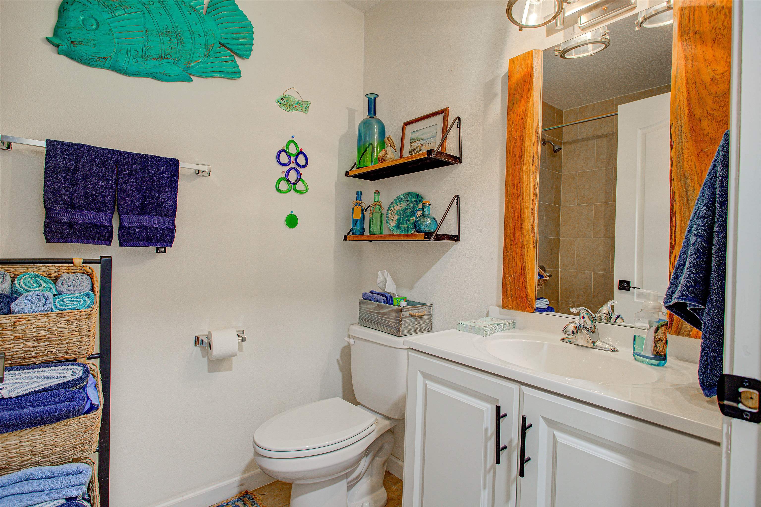 292 North Twin Maple Road St. Augustine, FL 32084 - Photo 32 of 79 a bathroom with a sink vanity mirror and toilet