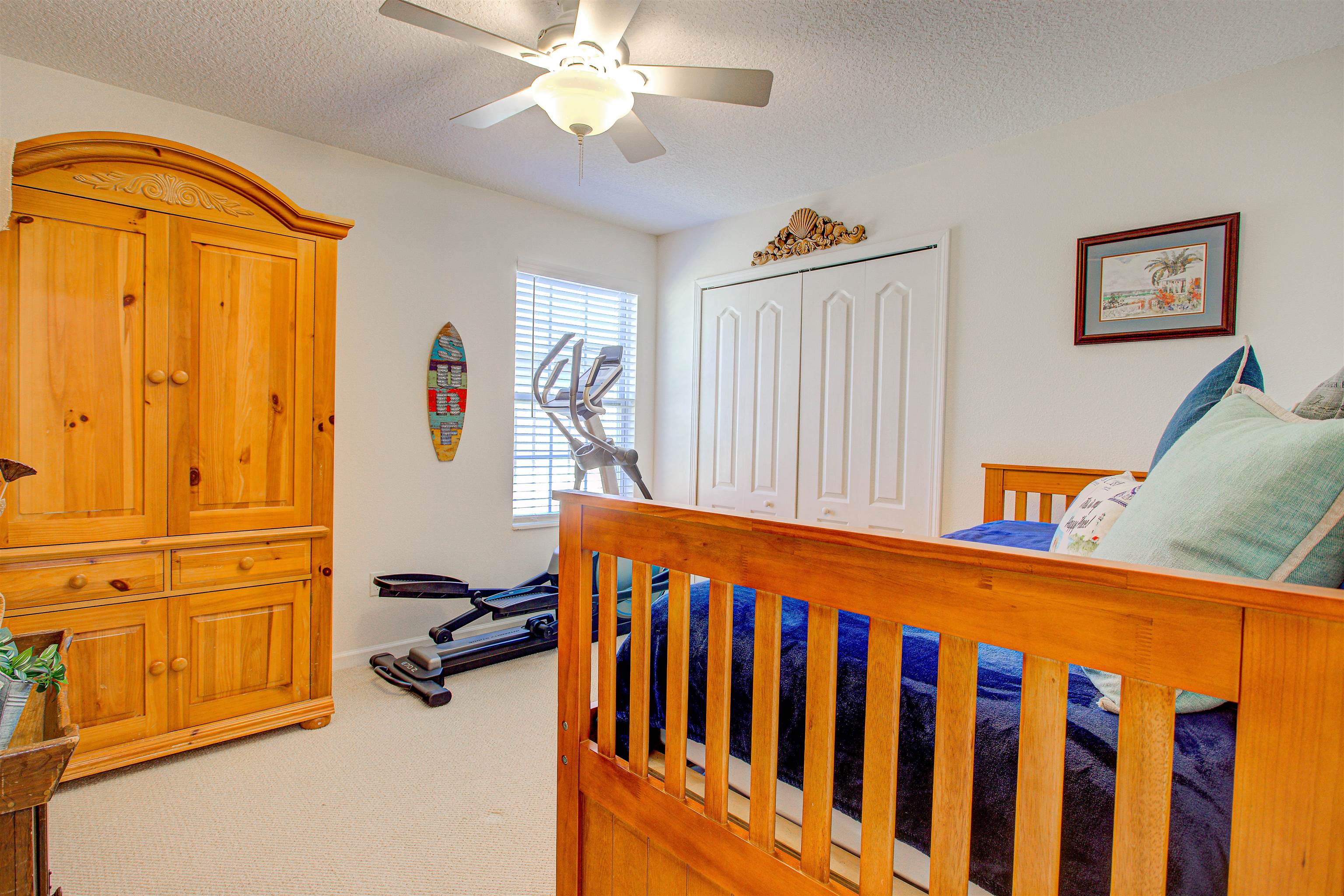 292 North Twin Maple Road St. Augustine, FL 32084 - Photo 38 of 79 Bedroom featuring light colored carpet, a closet, a textured ceiling, and a ceiling fan