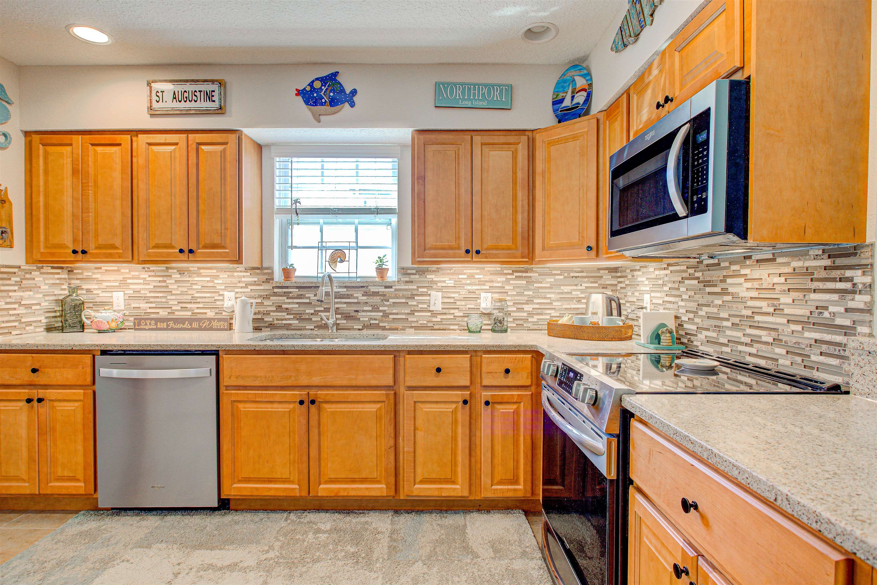 292 North Twin Maple Road St. Augustine, FL 32084 - Photo 41 of 79 a kitchen with stainless steel appliances granite countertop a sink and a microwave