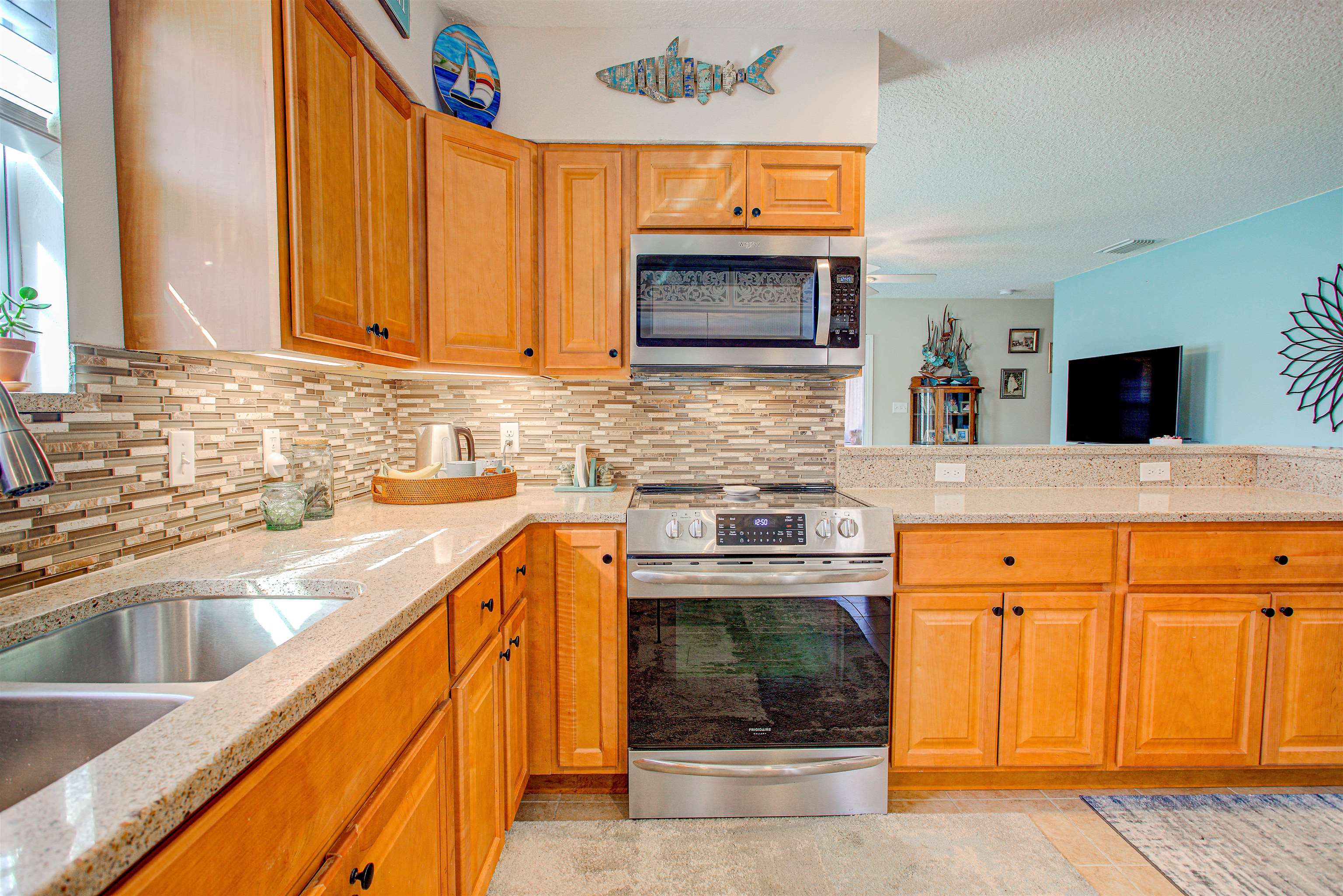 292 North Twin Maple Road St. Augustine, FL 32084 - Photo 43 of 79 a kitchen with stainless steel appliances granite countertop a sink stove and oven