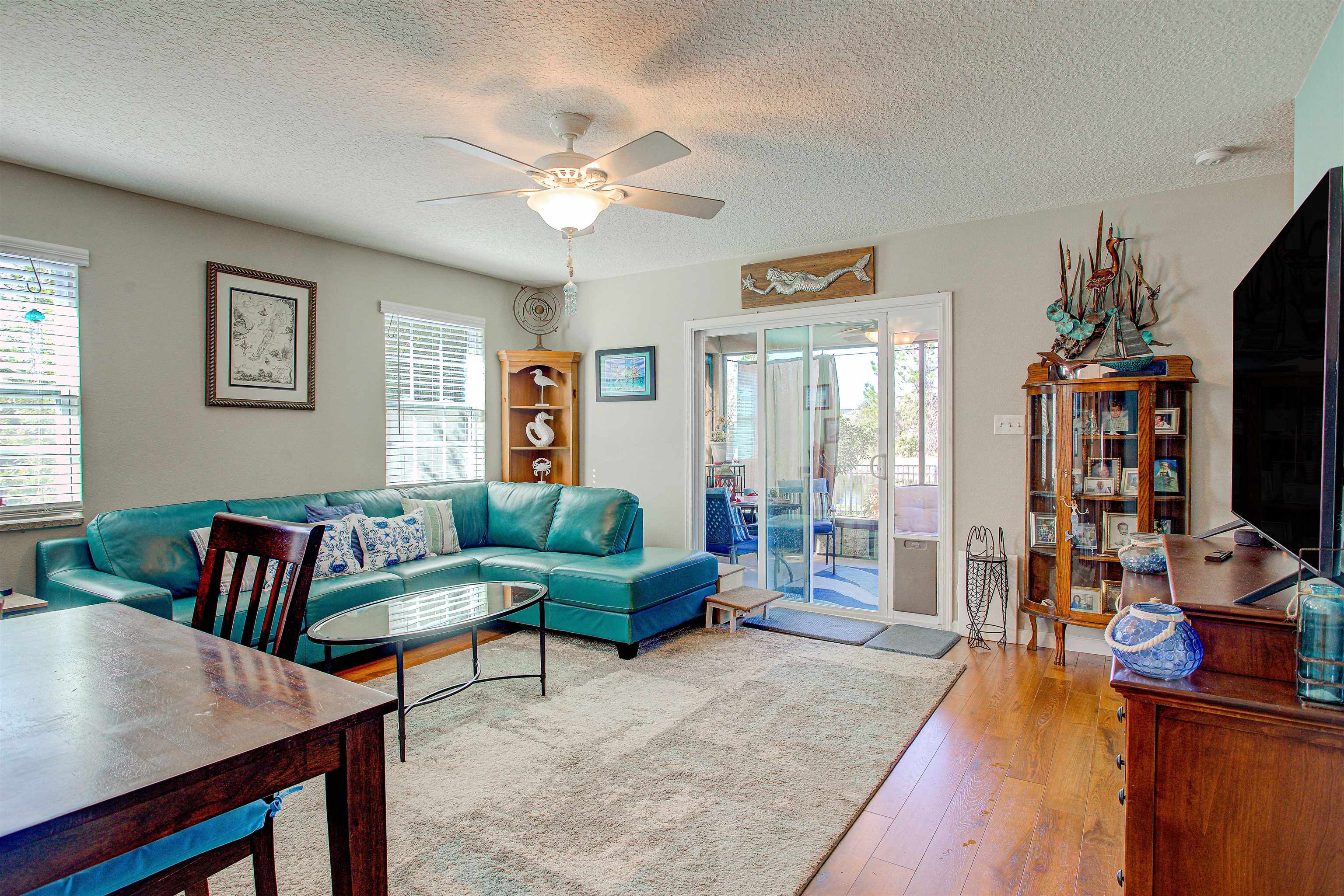 292 North Twin Maple Road St. Augustine, FL 32084 - Photo 47 of 79 a living room with furniture a flat screen tv and a large window