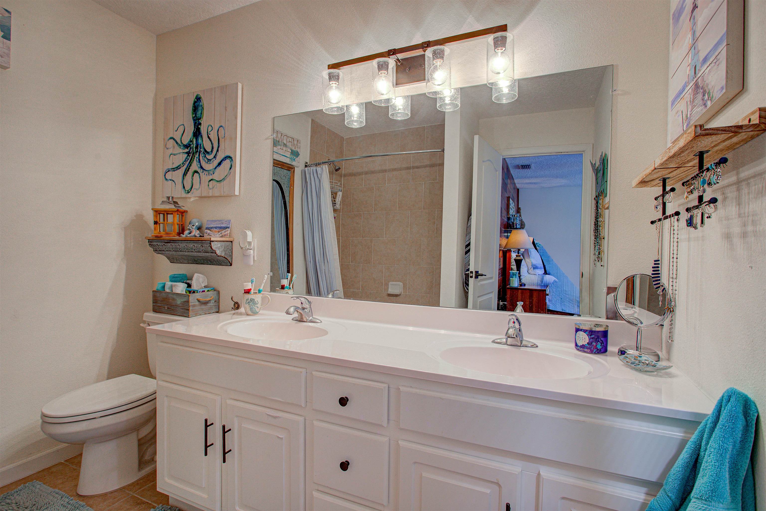 292 North Twin Maple Road St. Augustine, FL 32084 - Photo 55 of 79 Bathroom featuring double vanity, a shower with curtain, and light tile patterned floors