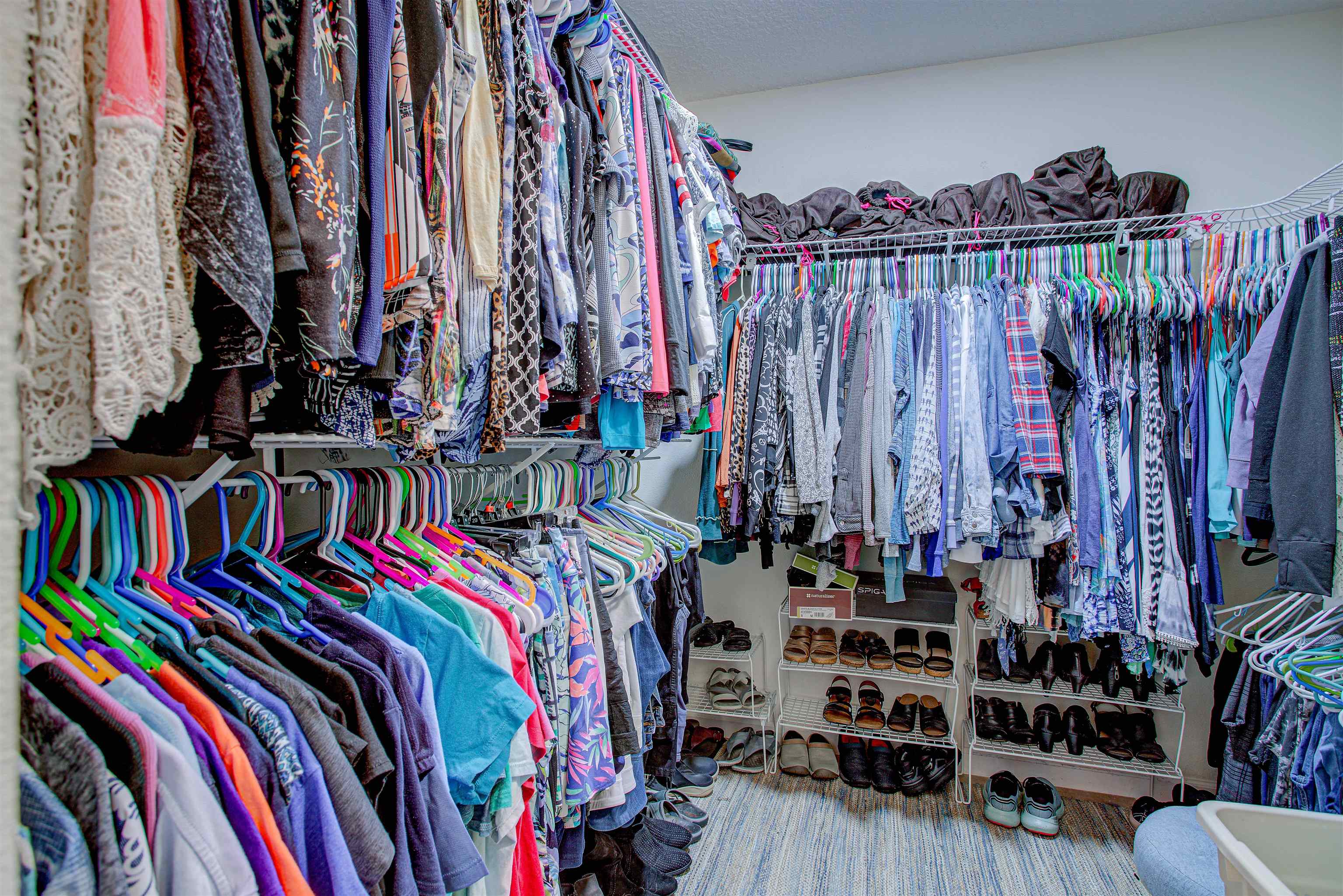 292 North Twin Maple Road St. Augustine, FL 32084 - Photo 58 of 79 a view of walk in closet with clothes and shoes