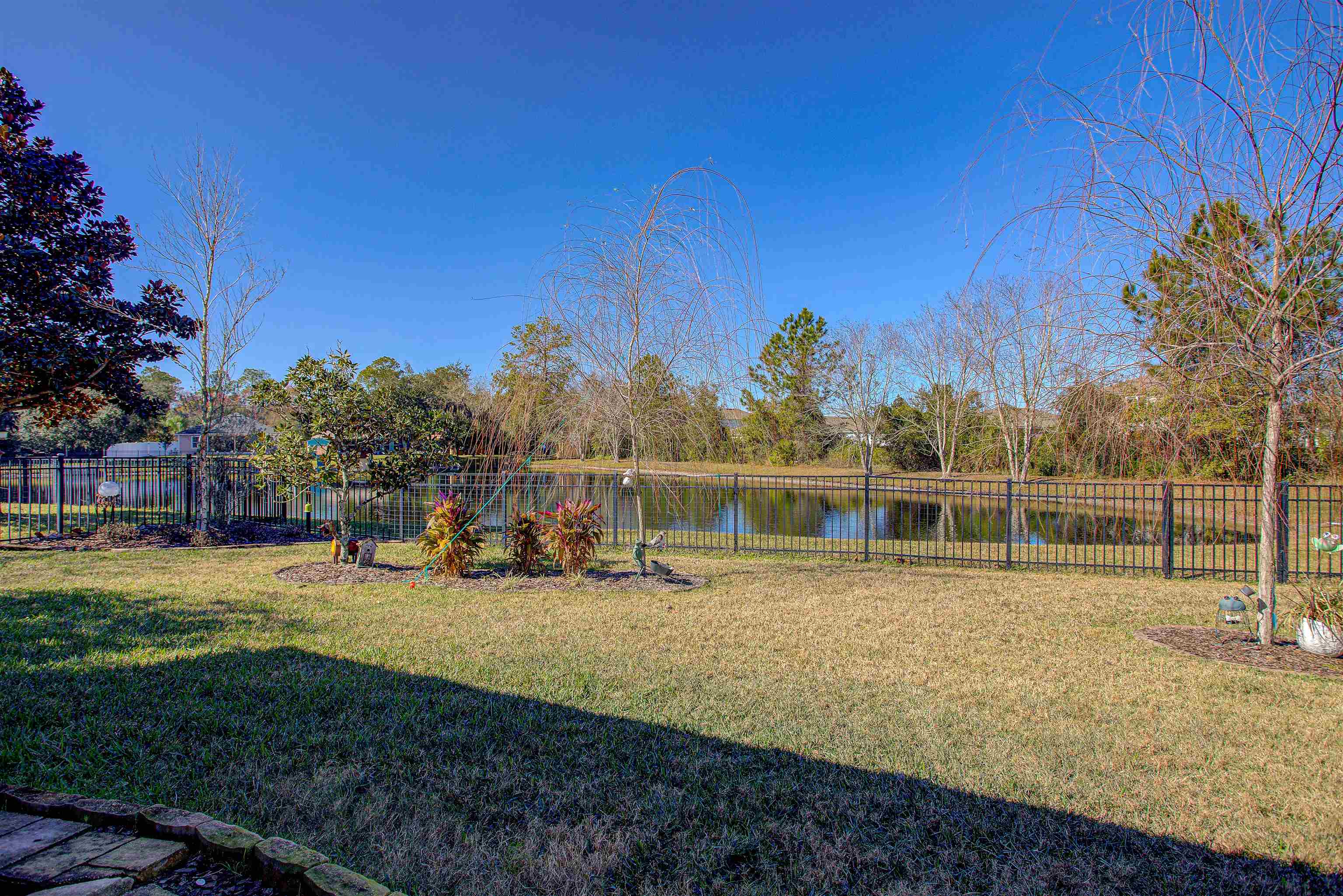 292 North Twin Maple Road St. Augustine, FL 32084 - Photo 65 of 79 a view of a yard with table and chairs