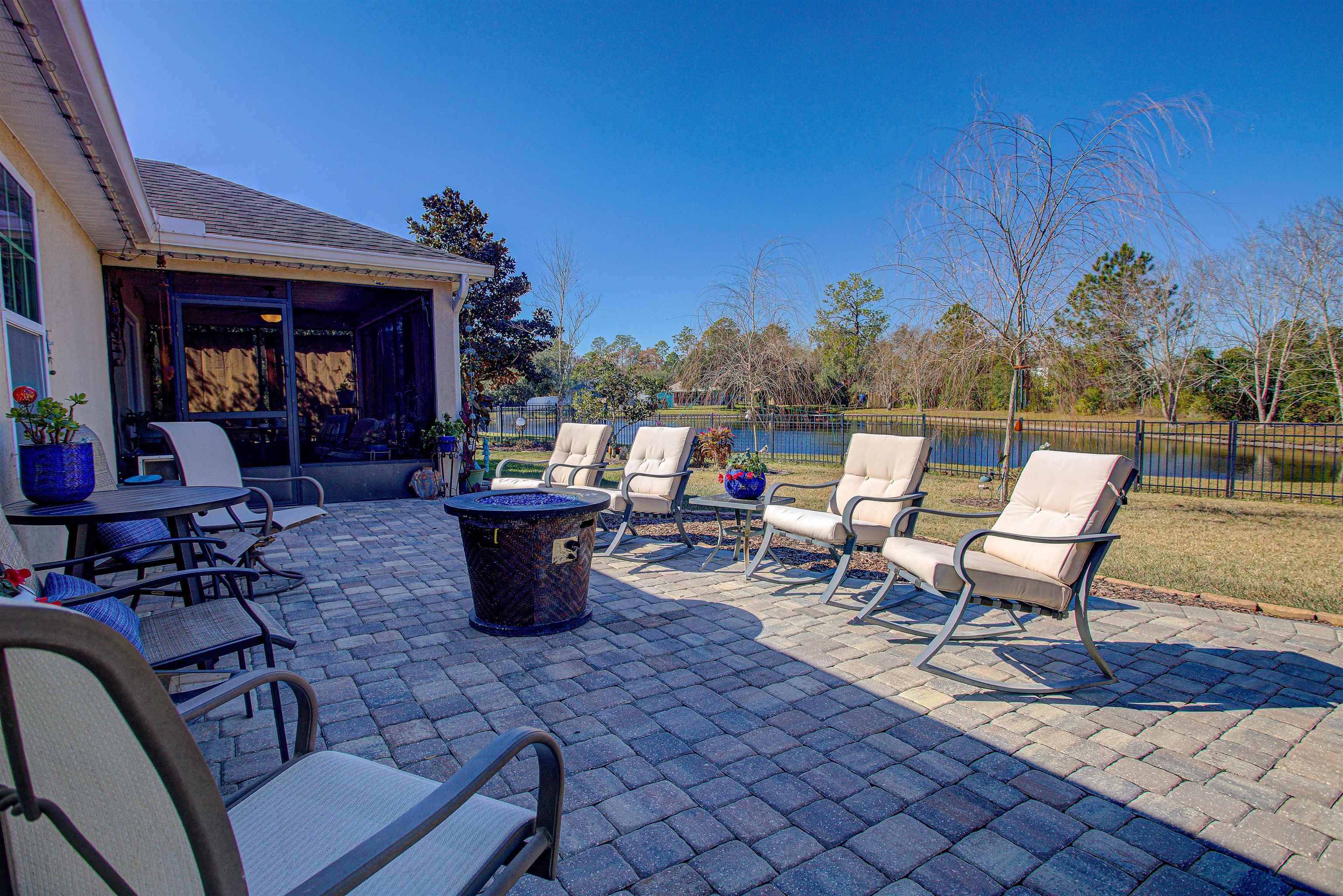 292 North Twin Maple Road St. Augustine, FL 32084 - Photo 70 of 79 a view of a patio with table and chairs potted plants with wooden floor and outdoor seating
