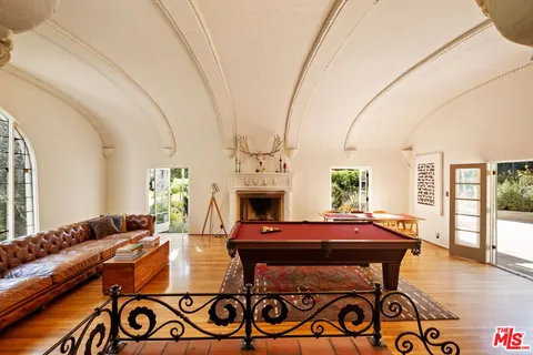 a view of a fireplace with wooden floor