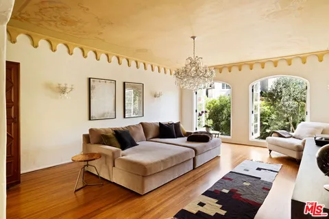 a kitchen with stainless steel appliances a sink stove and cabinets