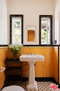 a front view of a house with a mountain