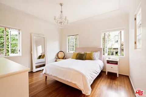 an aerial view of a house with a yard and garden