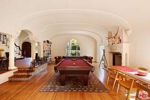 a living room with furniture a large window with outer view